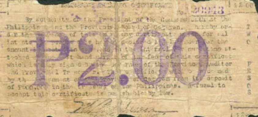 Philippine two-peso note featuring intricate text and a prominent "P2.00" denomination.