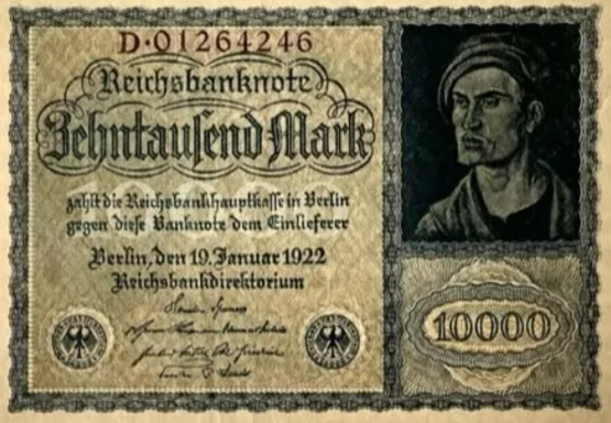 Banknote featuring a man’s portrait and ornate decorative elements, valued at 10,000 Marks.