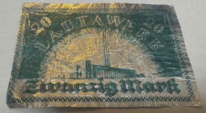 A 20-mark banknote featuring a factory illustration and ornate design.