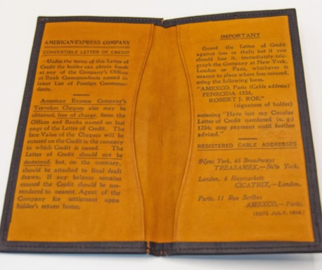 A leather-bound document cover with printed text on a golden background.