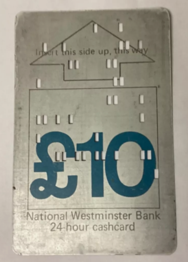 A silver cash card with embossed Braille and a £10 denomination.